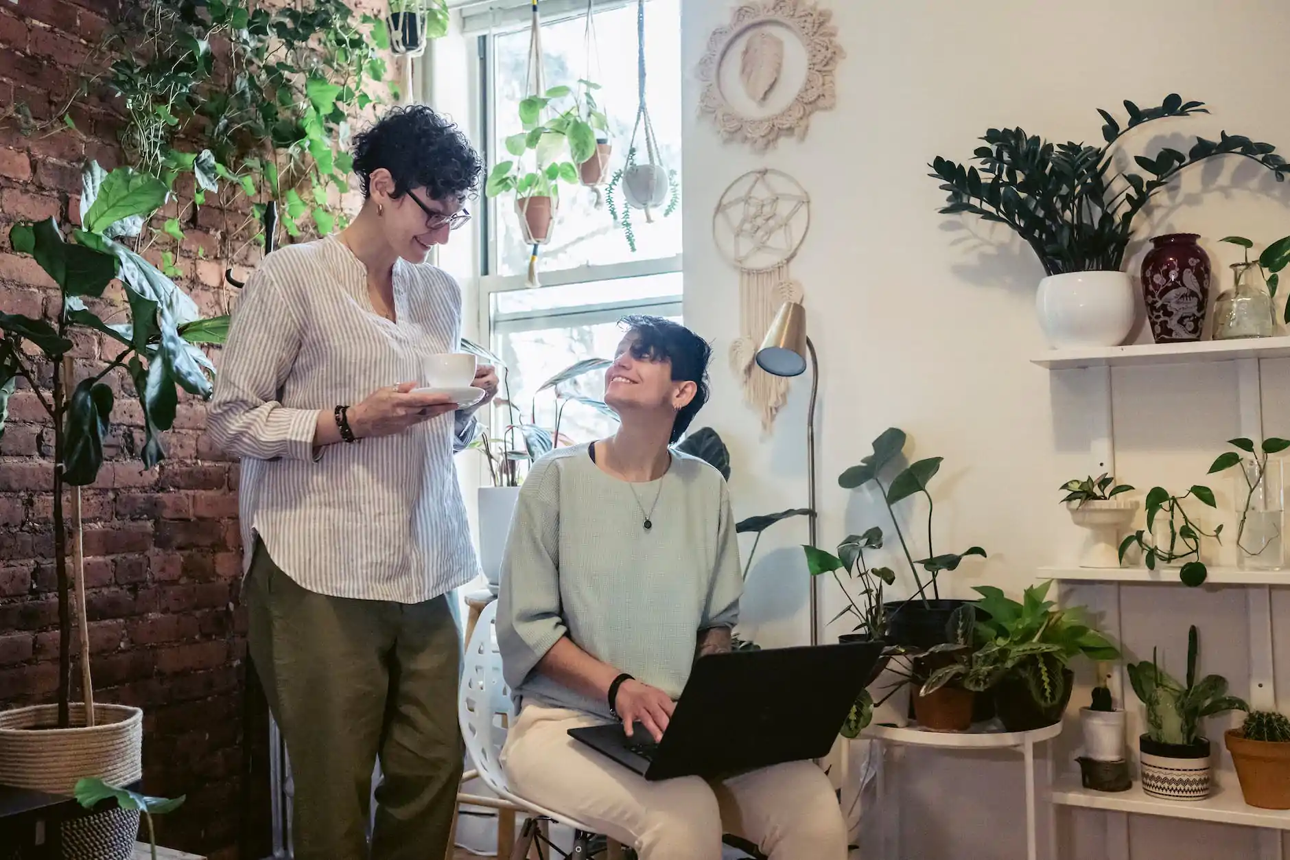 happy coworkers smiling during remote work in cozy workspace